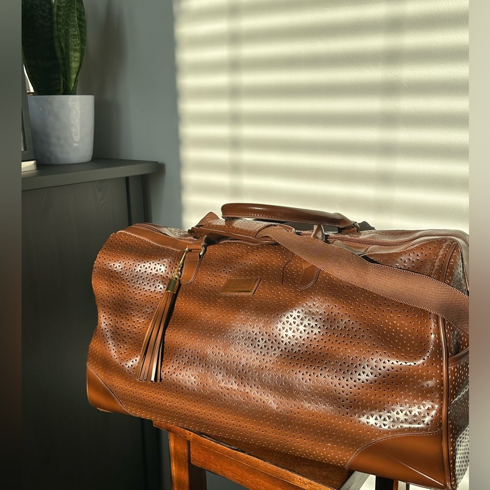 Nicole Miller Perforated faux Leather Duffle Bag
